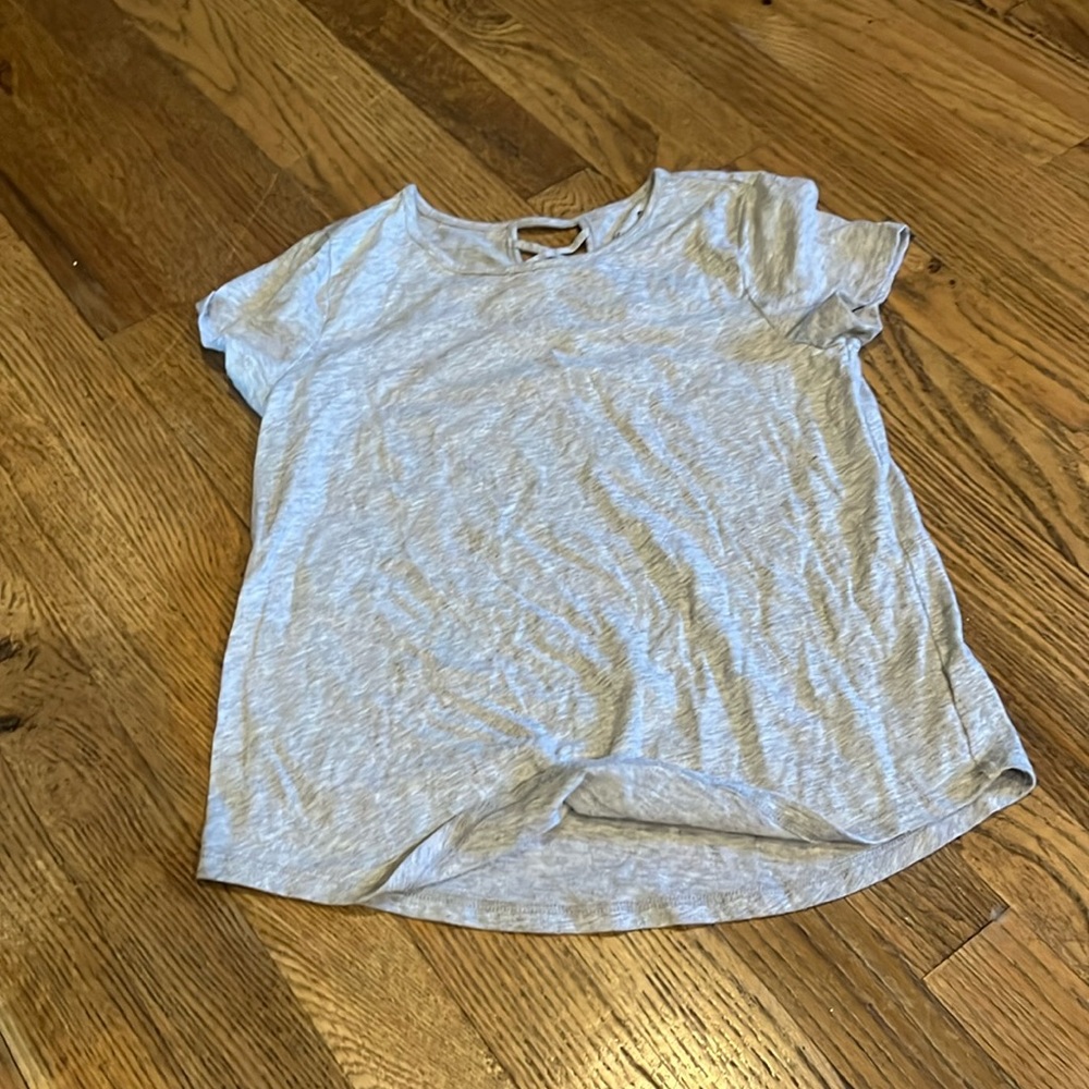 I'm selling a gray tee short sleeve brand is favorite tee and is a size L 10/12